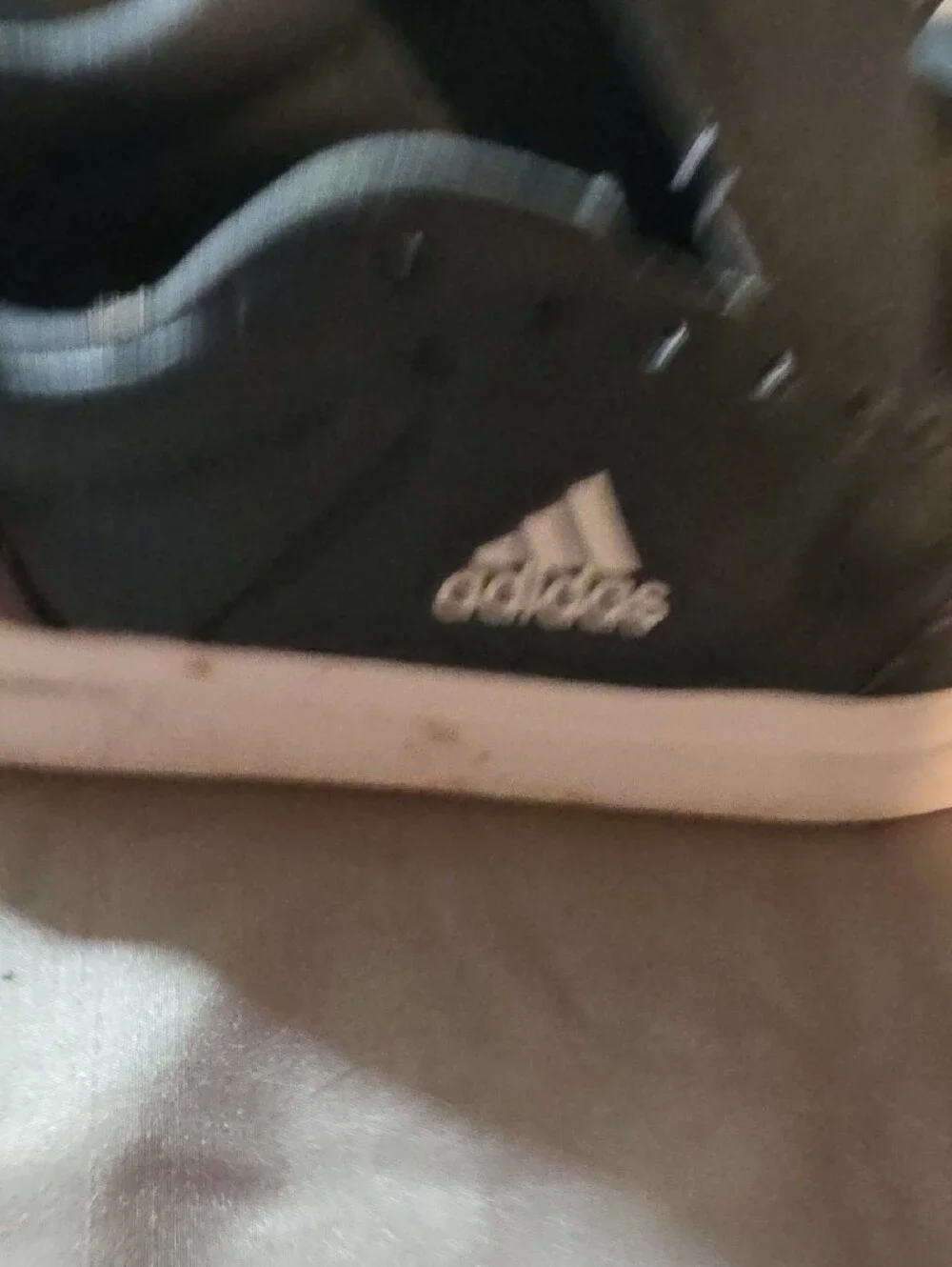 Adidas Black Sneakers with White Soles and Brown Heel Accent